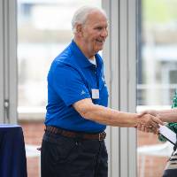 Jim Scott shaking hands with male coworker